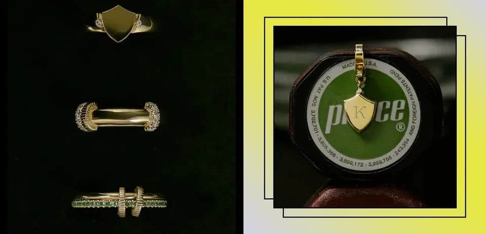 Varios anillos y un colgante de oro sobre fondo oscuro