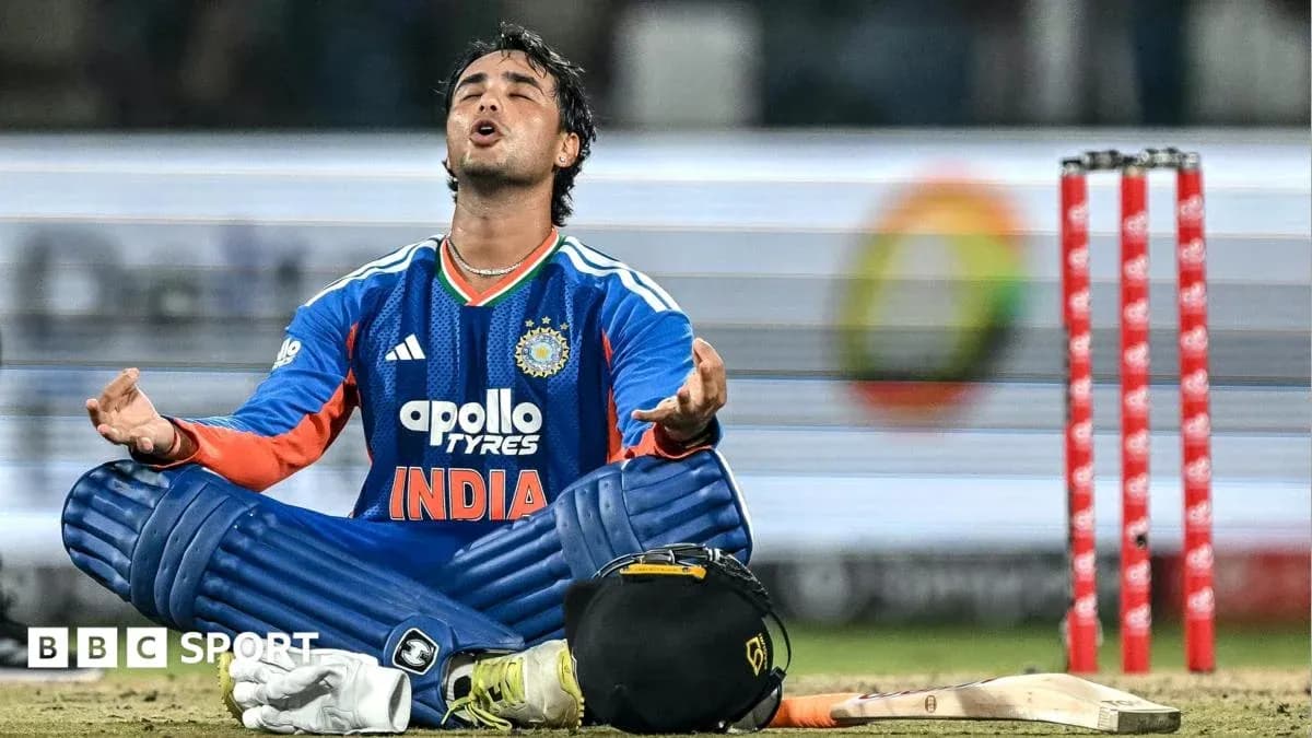 Jugador de cricket sentado en el campo de juego