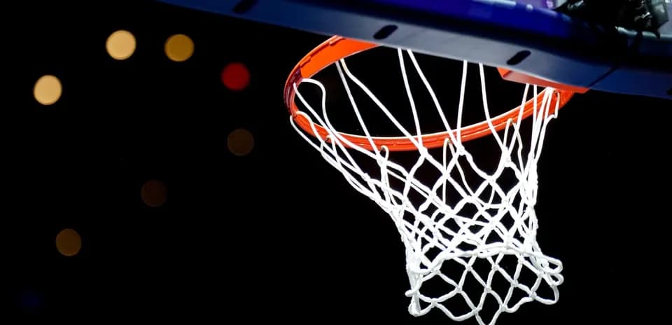 A close-up of a basketball hoop and net
