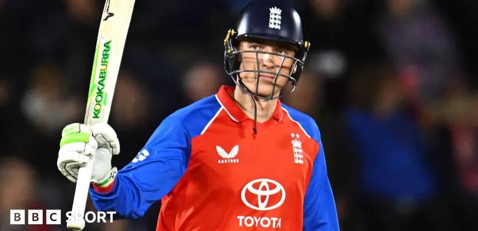 Jugador de cricket levantando su bate en celebración