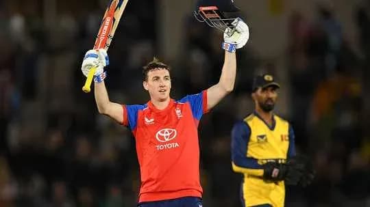Jugador de cricket celebrando con bate levantado