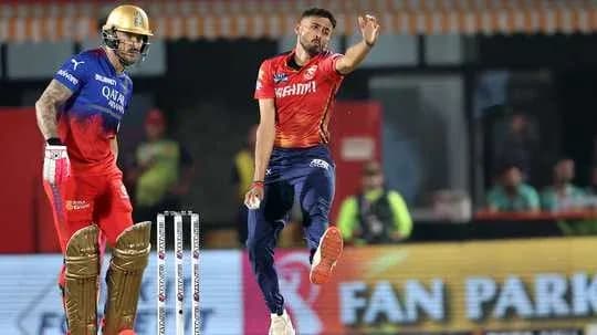 Bowler delivering ball while batsman prepares to hit
