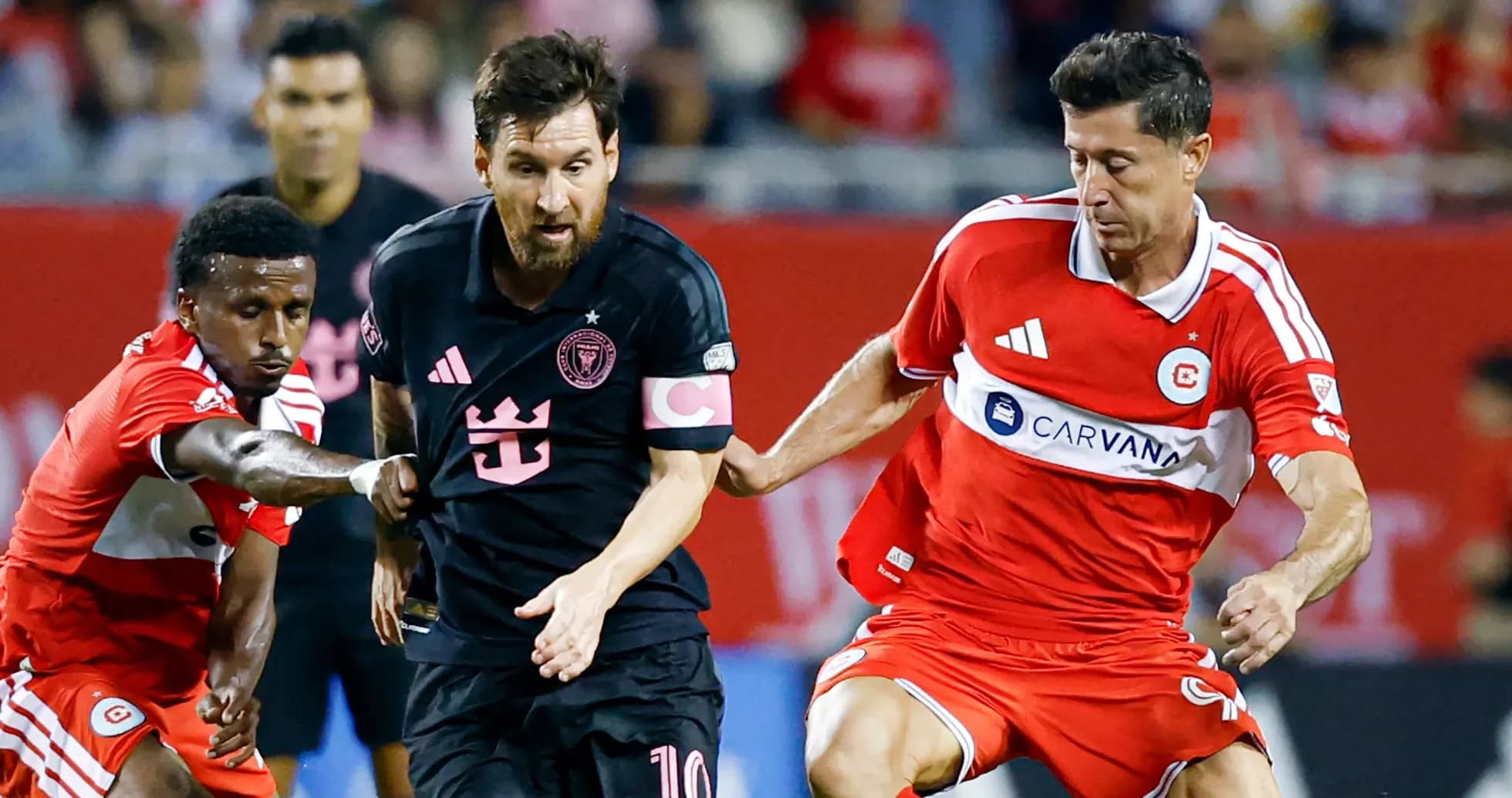 Lionel Messi dribbling past defenders during match
