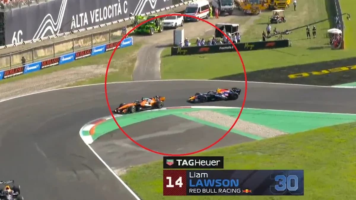 Dos coches de Fórmula 1 compitiendo en curva Dos coches de Fórmula 1 compitiendo en curva