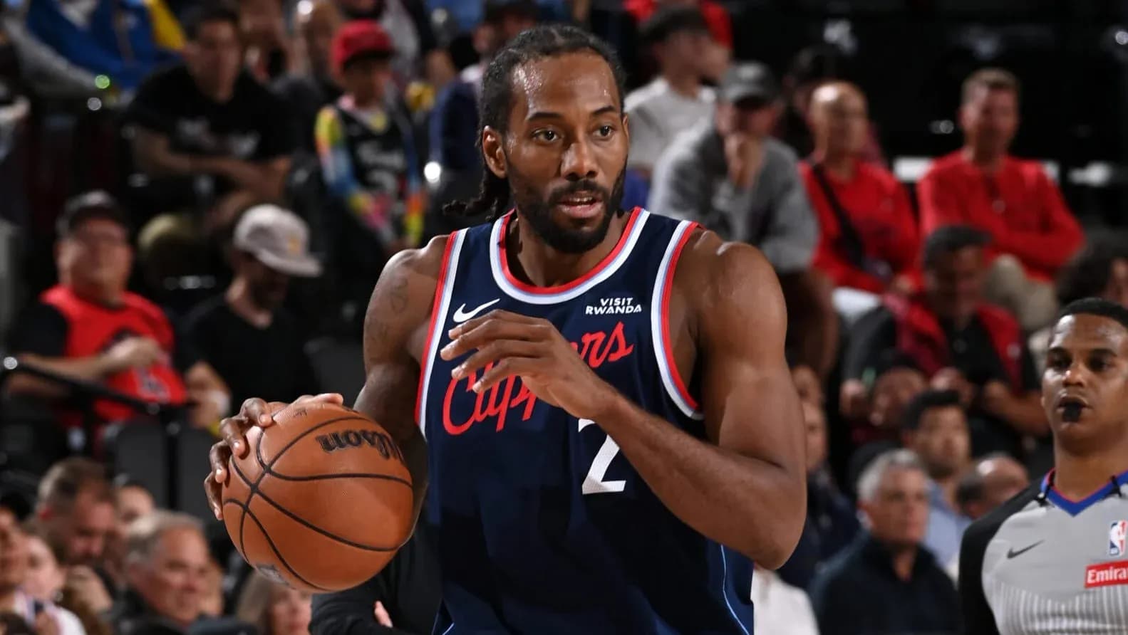 Kawhi Leonard dribbling the ball during a game Kawhi Leonard dribbling the ball during a game