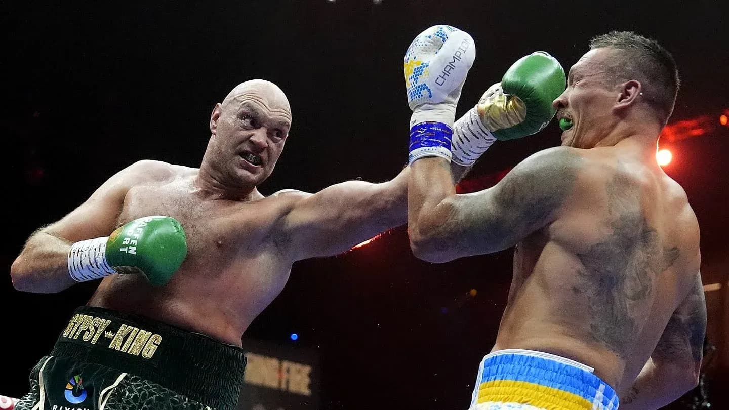 Tyson Fury throwing a punch at Oleksandr Usyk Tyson Fury throwing a punch at Oleksandr Usyk