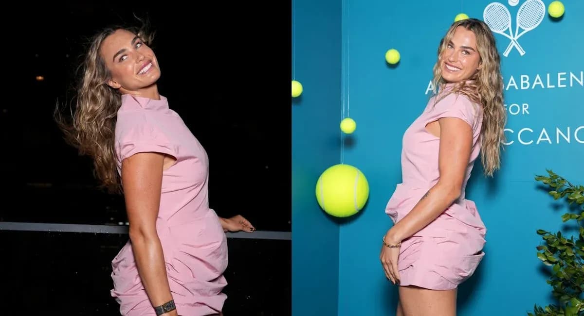 Mujer sonriendo con vestido rosa en evento Mujer sonriendo con vestido rosa en evento
